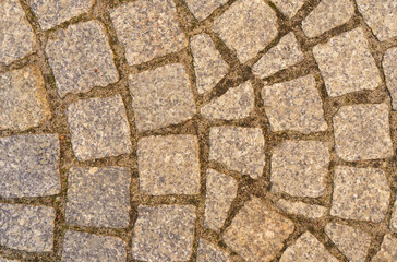 Abstract background of old cobblestone close up.