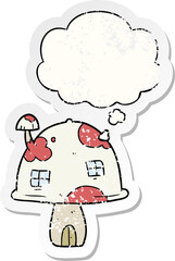 cartoon mushroom house and thought bubble as a distressed worn sticker