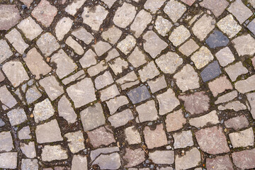 Abstract background of old cobblestone close up.