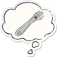 cartoon spanner and thought bubble as a distressed worn sticker