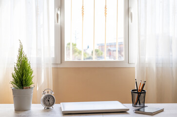 Obraz na płótnie Canvas Home Workplace By The Window With Natural Light.