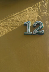House number 12. Glazed decorated numbers