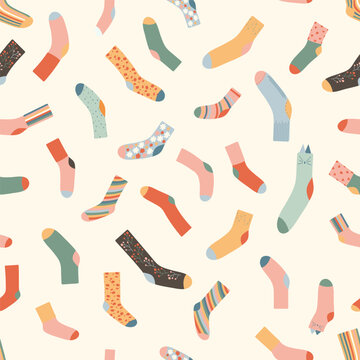 Seamless pattern with colorful socks. Warm accessories with modern patterns. Unisex clothes in neutral colors on light background. Retro muted palette. Vector illustration
