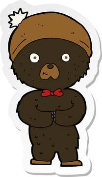 sticker of a cartoon little black bear