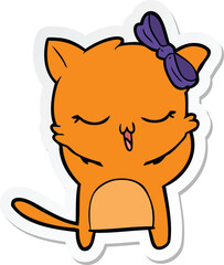 sticker of a cartoon cat with bow on head