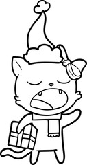 line drawing of a cat with christmas present wearing santa hat