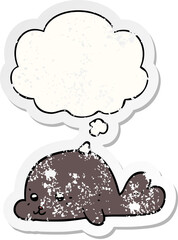 cartoon baby seal and thought bubble as a distressed worn sticker