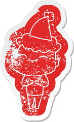 happy cartoon distressed sticker of a bald man wearing santa hat
