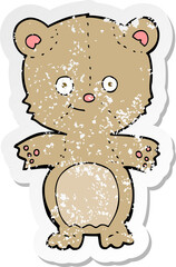 retro distressed sticker of a cartoon teddy bear