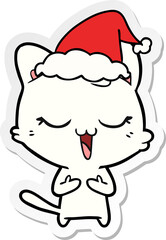 happy sticker cartoon of a cat wearing santa hat
