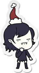 sticker cartoon of a undead vampire girl wearing santa hat