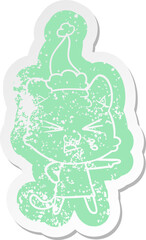 cartoon distressed sticker of a hissing cat wearing santa hat