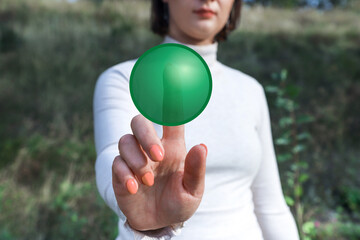 Woman pressing the green virtual button. Mockup photo. Concept of making a choice