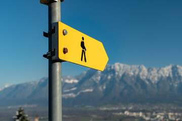 Hiking sign in an alpine scenery in Grabs in Switzerland