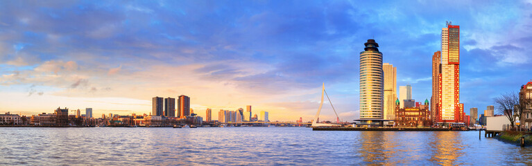 Fototapeta na wymiar Cityscape, panorama, banner - view of Rotterdam with Tower blocks in the Kop van Zuid neighbourhood and Erasmus Bridge, The Netherlands