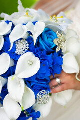 wedding rings and bouquet of flowers