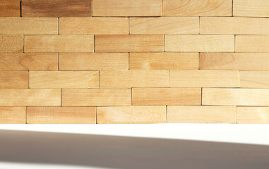 A wall of wooden blocks. Rustic background for interior design.