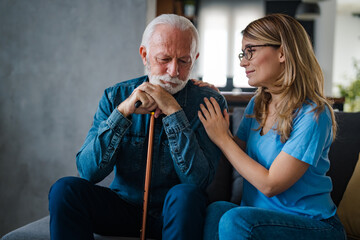 Young nurse spend time with old man, shares his pain, express empathy caring about 80s patient...