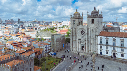 Fototapeta na wymiar Lisbon, Portugal. April 12, 2022: Beautiful postcard of Porto's cathedral and blue sky.