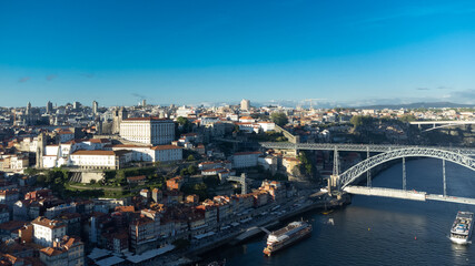 Fototapeta na wymiar Oporto, Portugal. April 12, 2022: Aerial landscape of the Luis I bridge and the city.