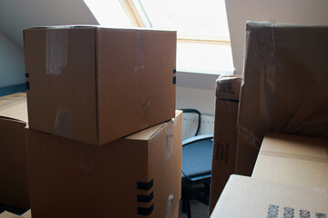 close up of moving cardboard boxes in a room