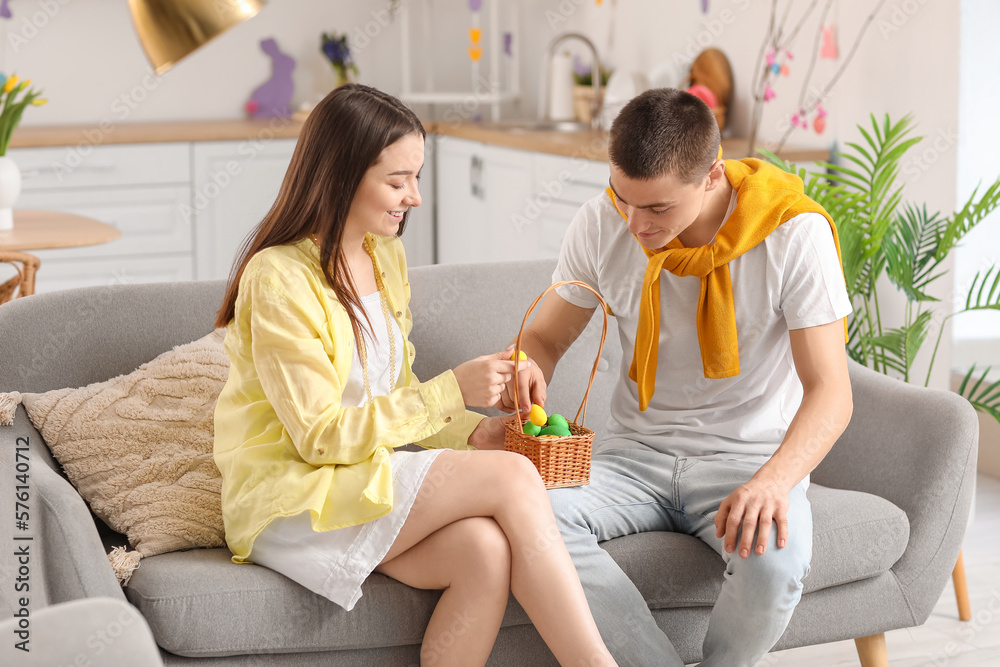 Canvas Prints happy young couple with easter eggs at home