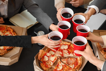 Group of business people with cola and tasty pizza in office, closeup