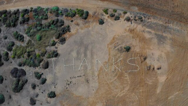 "Thanks" made of shells, Santa Maria, Sal Island, Cape Verde. Drone footage.