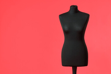 Black mannequin on red background