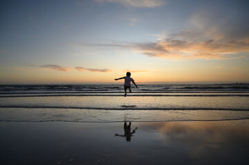 A boy jumping on the sea