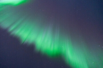 Looking directly up into the Aurora Borealis seen in Yukon Territory, Canada during winter season with green, purple and pink colors. 