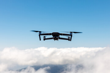 Fototapeta na wymiar Drone flying over the clouds.