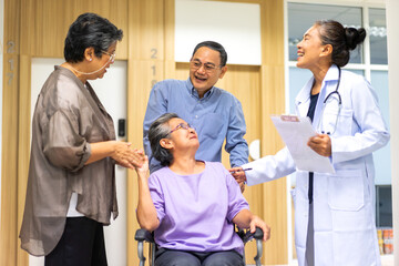 Fototapeta premium Portrait of smiling caring asian doctor help support discussing and consulting taking care with sick senior elderly asian woman patien at hospital.senior retirement care and insurance concept