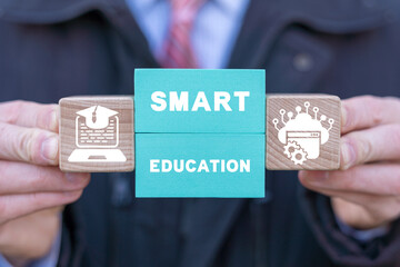 Smart Online Education AI Big Data Cloud Computing Concept. Student holding colorful blocks with conceptual banner: SMART EDUCATION. Intellectual e-learning technology.