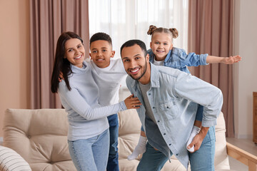 Happy international family spending time together at home