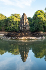 Beautiful reflection of Neak Pean temple with holy pond in ancient Khmer civilization in Siem Reap, Cambodia.