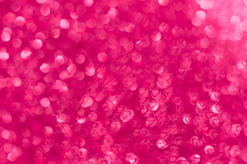 Red glitter texture defocused bokeh lights. Defocused bokeh hearts background. Valentine's day....