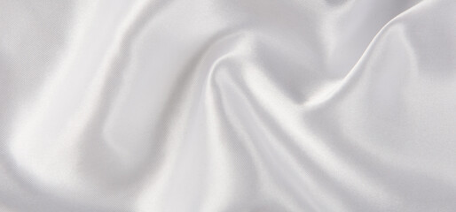 Smooth elegant white silk or satin luxury cloth texture background. 