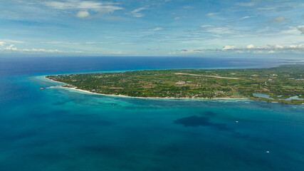Fototapeta na wymiar Seascape with tropical island and beach in the sea. Bantayan island, Philippines.
