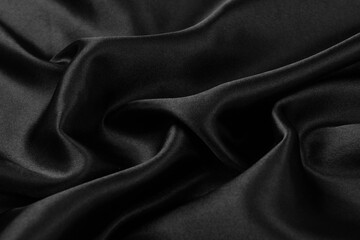 Obraz premium Smooth elegant black silk or satin luxury cloth texture background.
