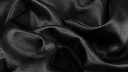 Smooth elegant black silk or satin luxury cloth texture background.