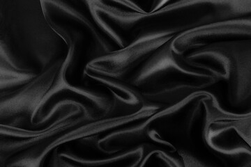 Obraz premium Smooth elegant black silk or satin luxury cloth texture background.