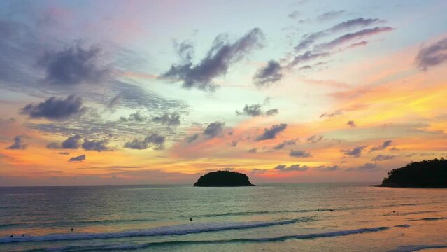 .aerial hyper lapse view beautiful sunset above Kala island at Layan beach Phuket..colorful sky of sunset at horizon.Phuket beach sea Amazing beach, .Beautiful beach Phuket Thailand, Nature 