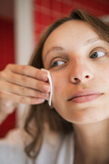 beautiful woman doing skincare in the morning