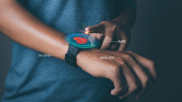 Man using smart watch technology checking heart rate.