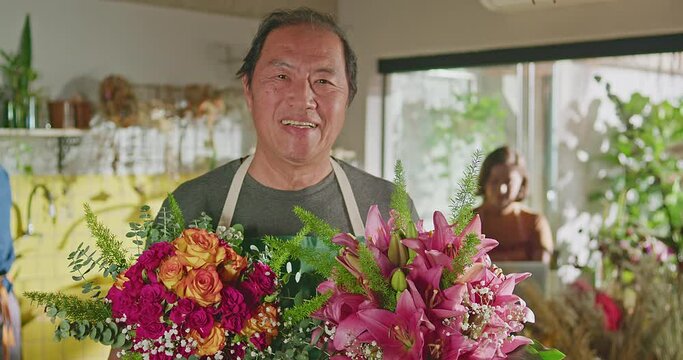 Entrepreneur owner of small business portrait face. Florist holding bouquet flowers looking at camera smiling. Job occupation concept