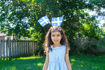 Girl celebrates the national holiday,
Drapeau qu&eacute;bec - Happy Quebec Day
Quebec's National Holiday,
La Fete Nationale du Quebec,
St. Jean-Baptiste