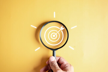 Magnifier glass focus to target objective with idea creative light bulb icon. planning development leadership and customer target group concept... - obrazy, fototapety, plakaty