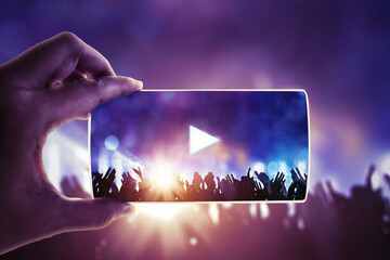 People hand holding their smart phones and photographing concert