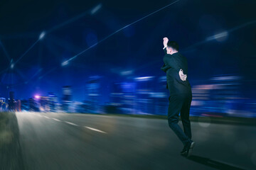 Fototapeta na wymiar Hologram of a businessman running in a virtual world